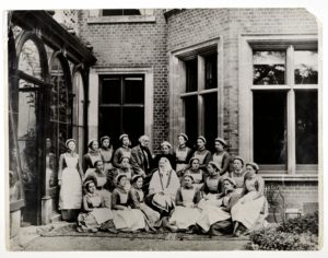Florence Nightingale with Sir Harry Verney and Miss Crossland, in the centre of a group of nurses at Claydon House, 1886 (b/w photo)