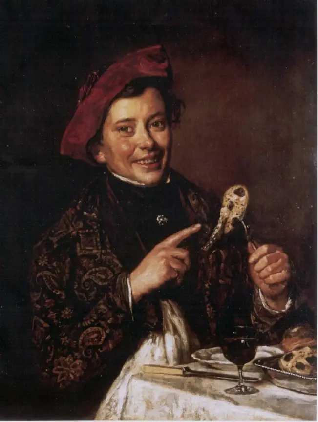 Portrait of a man, looking at the viewer. He is smiling and pointing at some food that is on a fork that he is holding with his other hand. He is wearing a red hat and a patterned jacket.