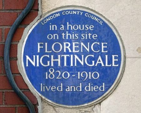 Blue plaque commemorating Florence Nightingale's former residence. The inscription reads: 'in a house on this site Florence Nightingale (1820-1910) lived and died.'
