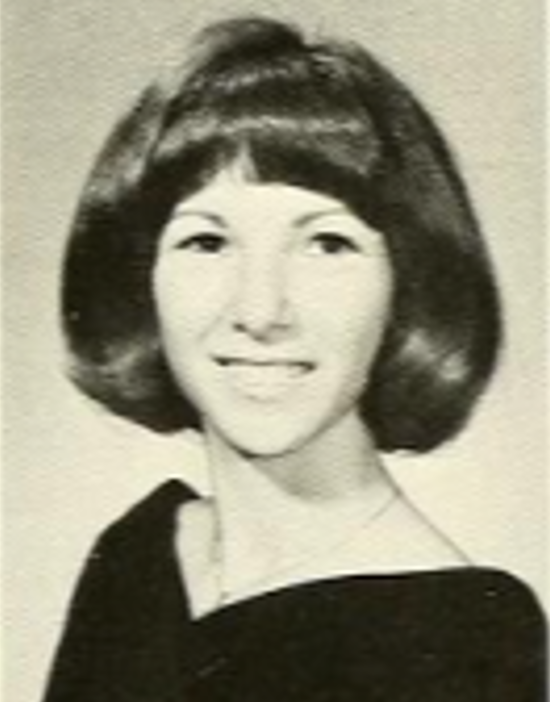Screenshot 2026-05-27 121958 Black and white photo of Susan. Hair cropped at chin. Wearing thin necklace