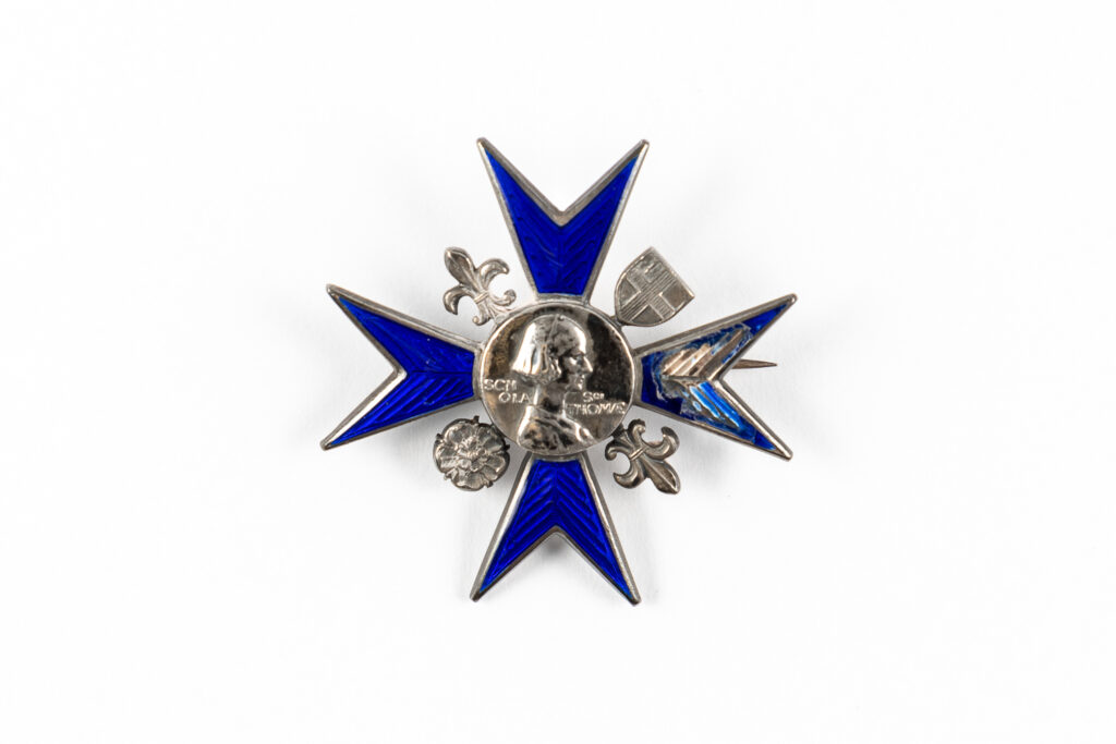 image of a Nightingale badge featuring minor damage to one side